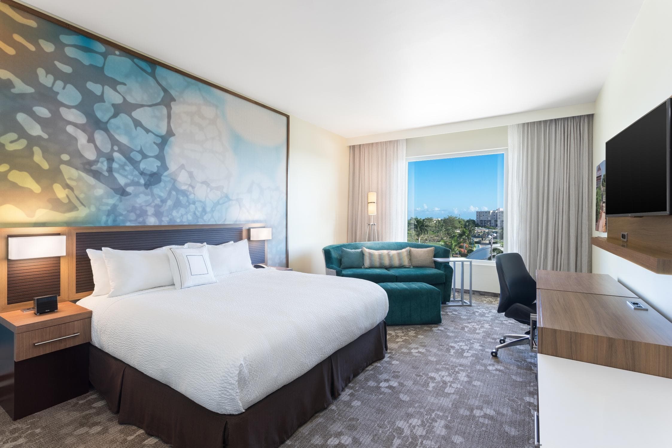 Enjoy a view from a King bed guest room