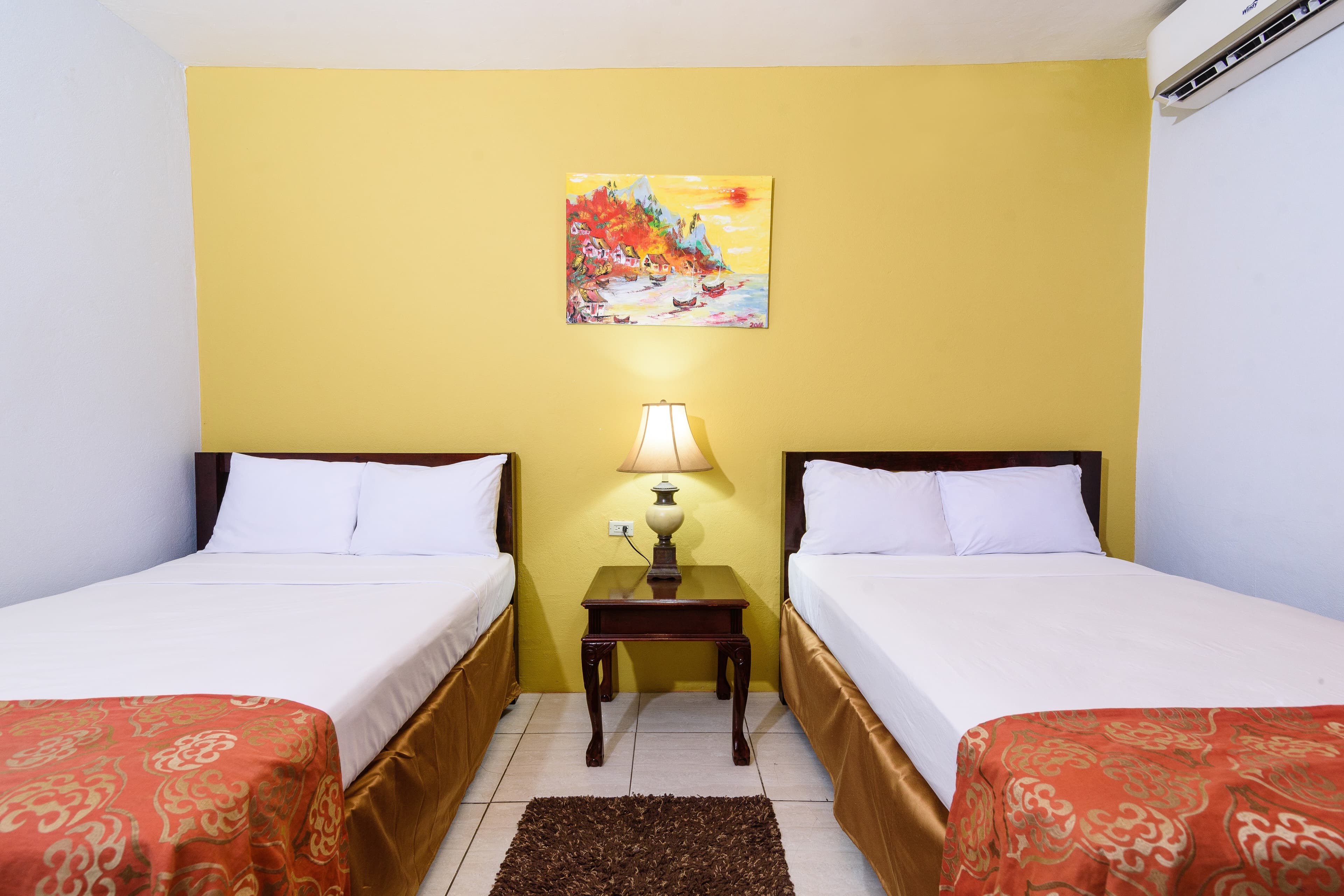 DELUXE ROOM offers two double beds, A/C, TV. Maximum four persons in this category room
