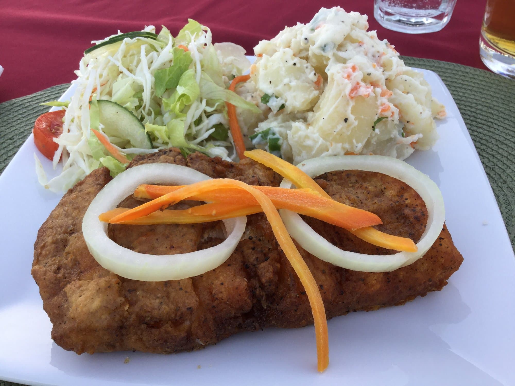 Pan fried snapper filet, salad and potato salad.