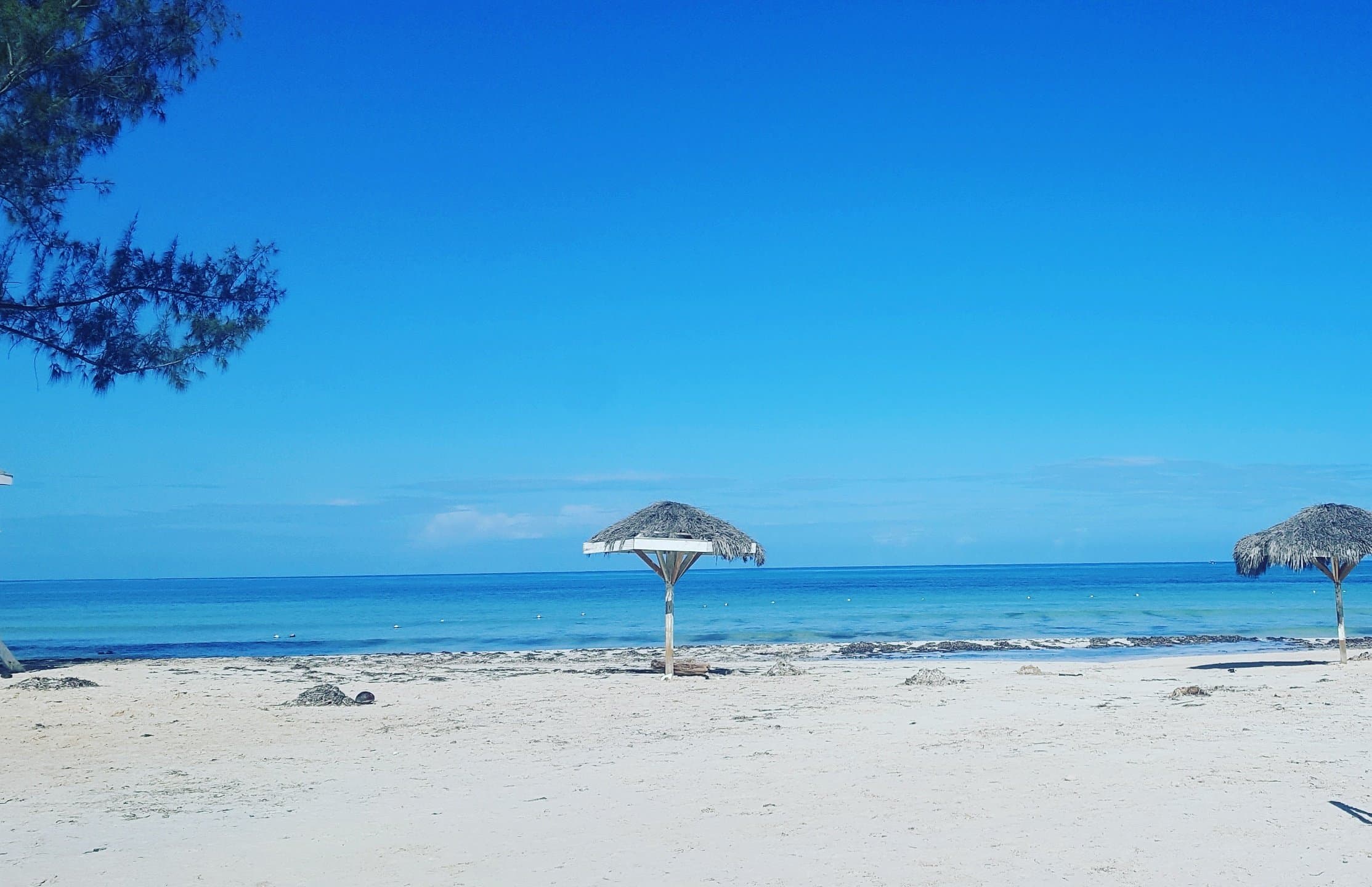 Relaxing, peaceful beach with shallow water.