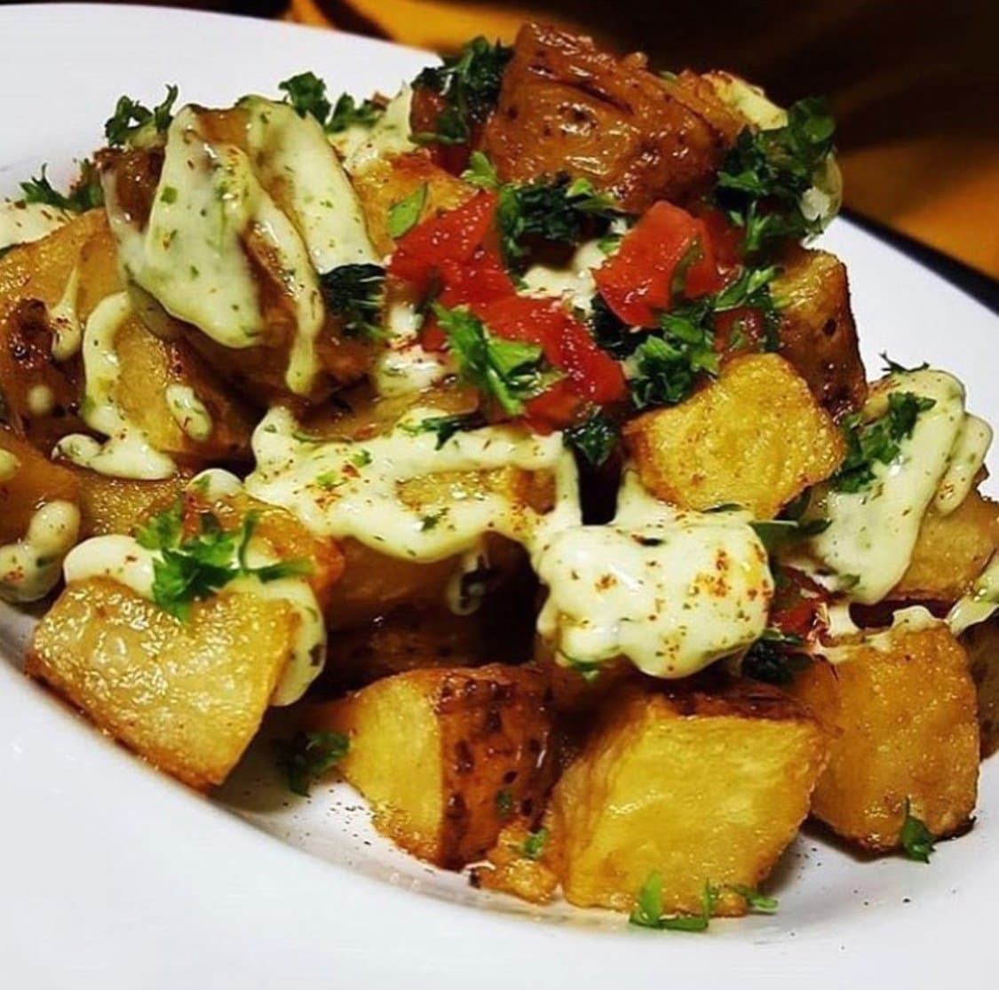 Patatas Bravas,diced tomatoes,garlic aioli
