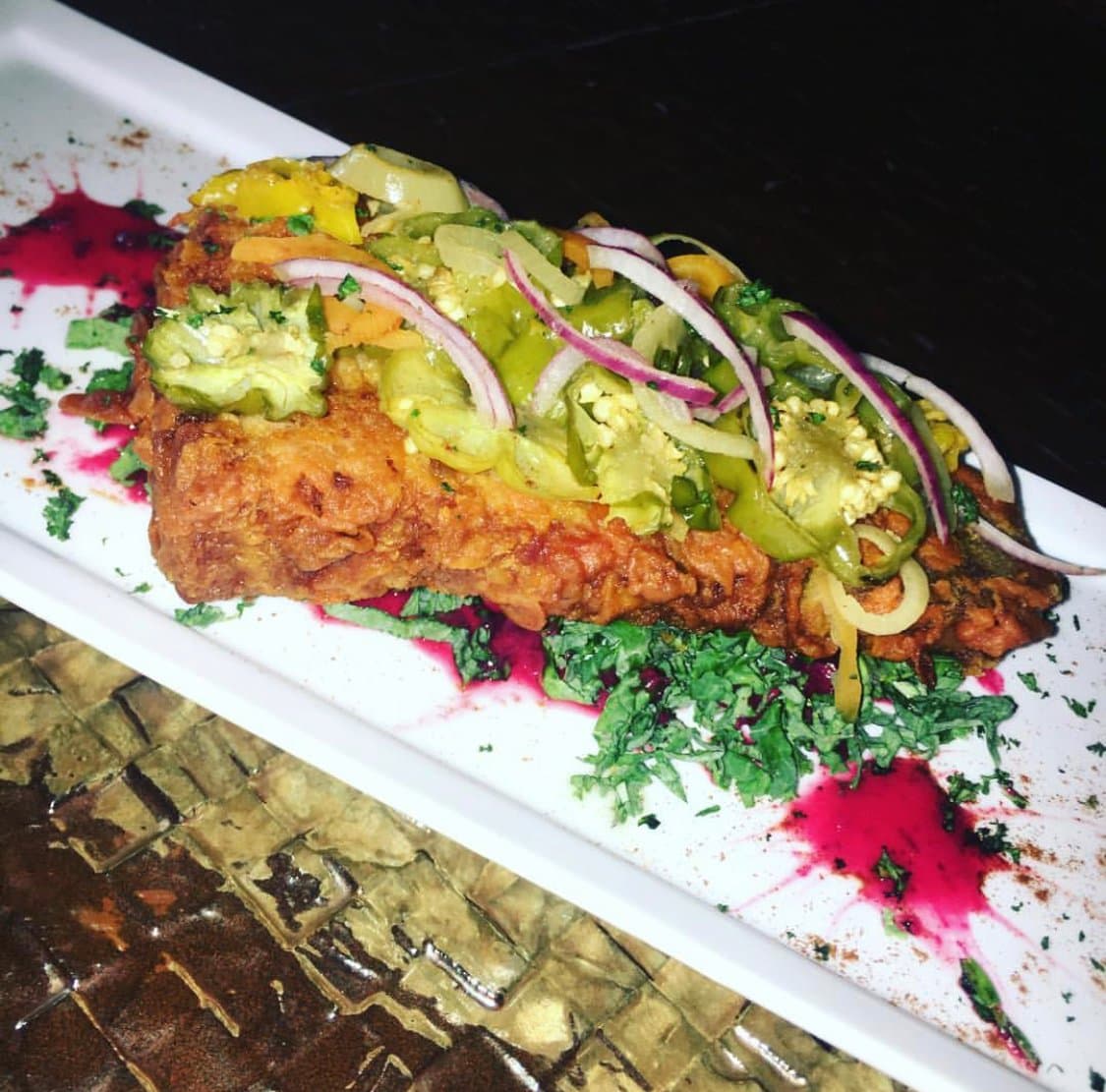 French Fried Smoked Pork Chop with escovitched pickeled vegetables and signature hibiscus dressing