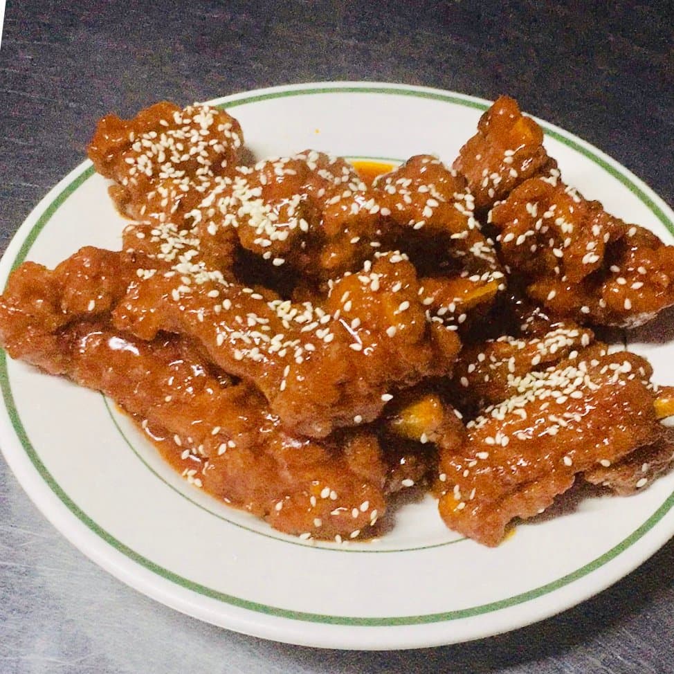 Spare Ribs with Chinese Style BBQ Sauce topped with sesame seeds