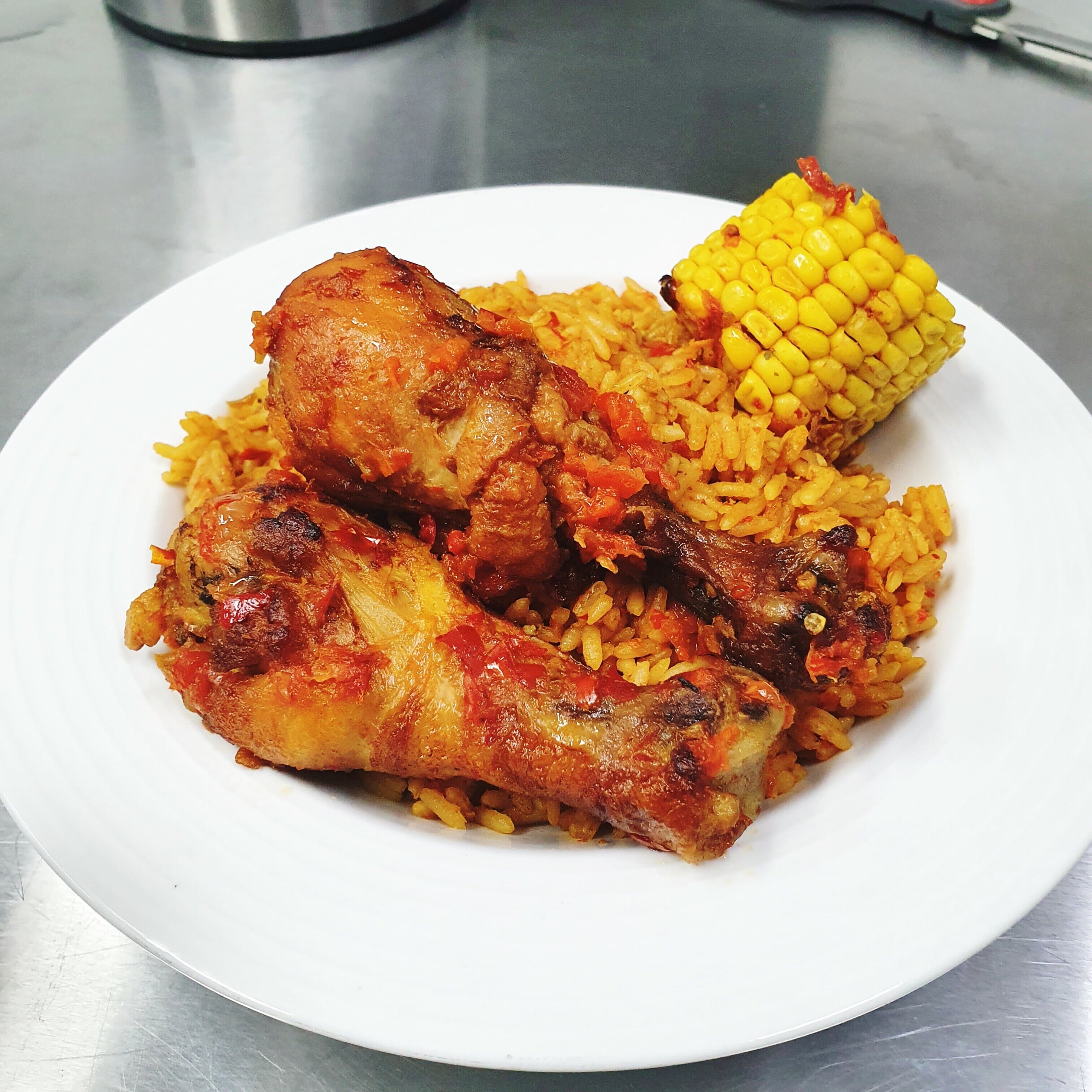 Jollof rice and stew chicken