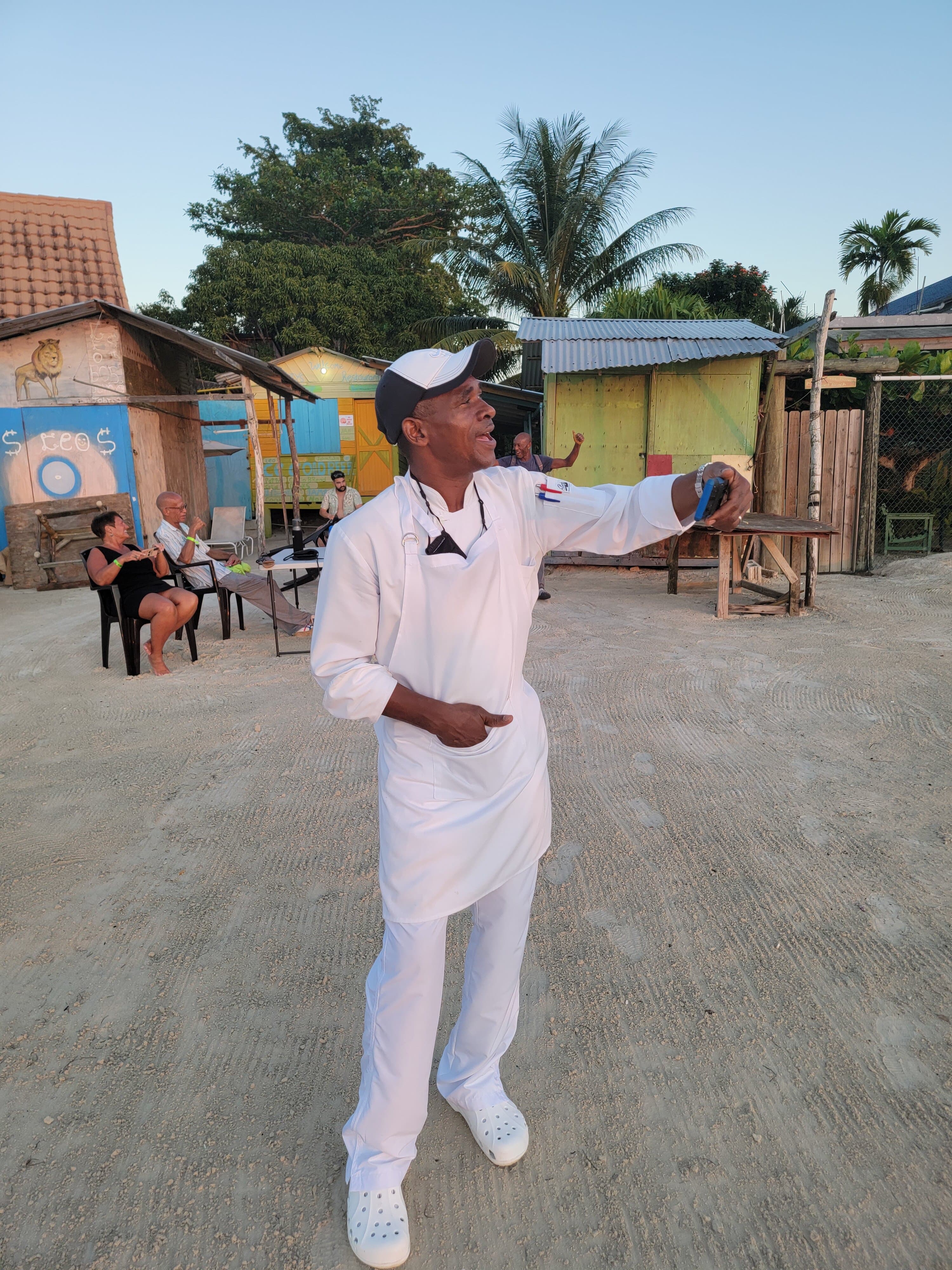 The Singing Chef serenades his customers at sunset.