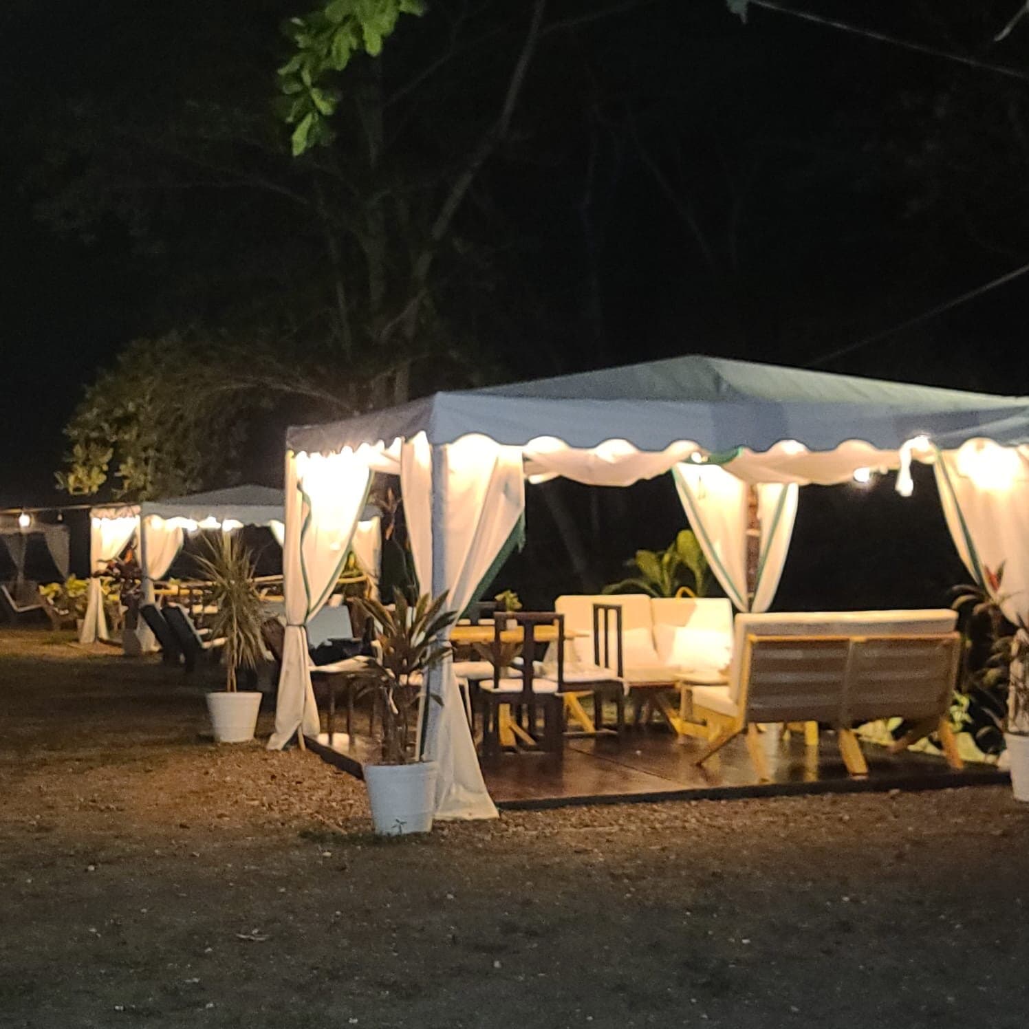 Dine under the stars in a riverside cabana.